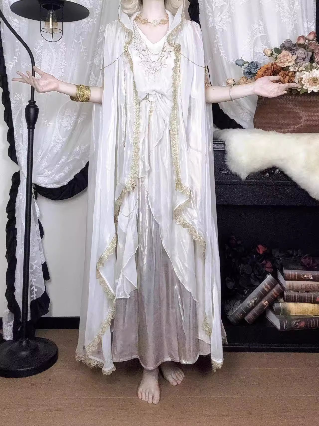 This White Angelic Greek Goddess Lolita Dress Set is designed to capture divine elegance and ethereal charm. The flowing cape adds a goddess-like aura, while the soft white palette enhances purity and grace. Inspired by Greek mythology and angelic beauty, the silhouette blends classic Lolita sweetness with majestic refinement. Perfect for special occasions, photoshoots, or themed gatherings, this set conveys a timeless elegance that feels both celestial and romantic.
