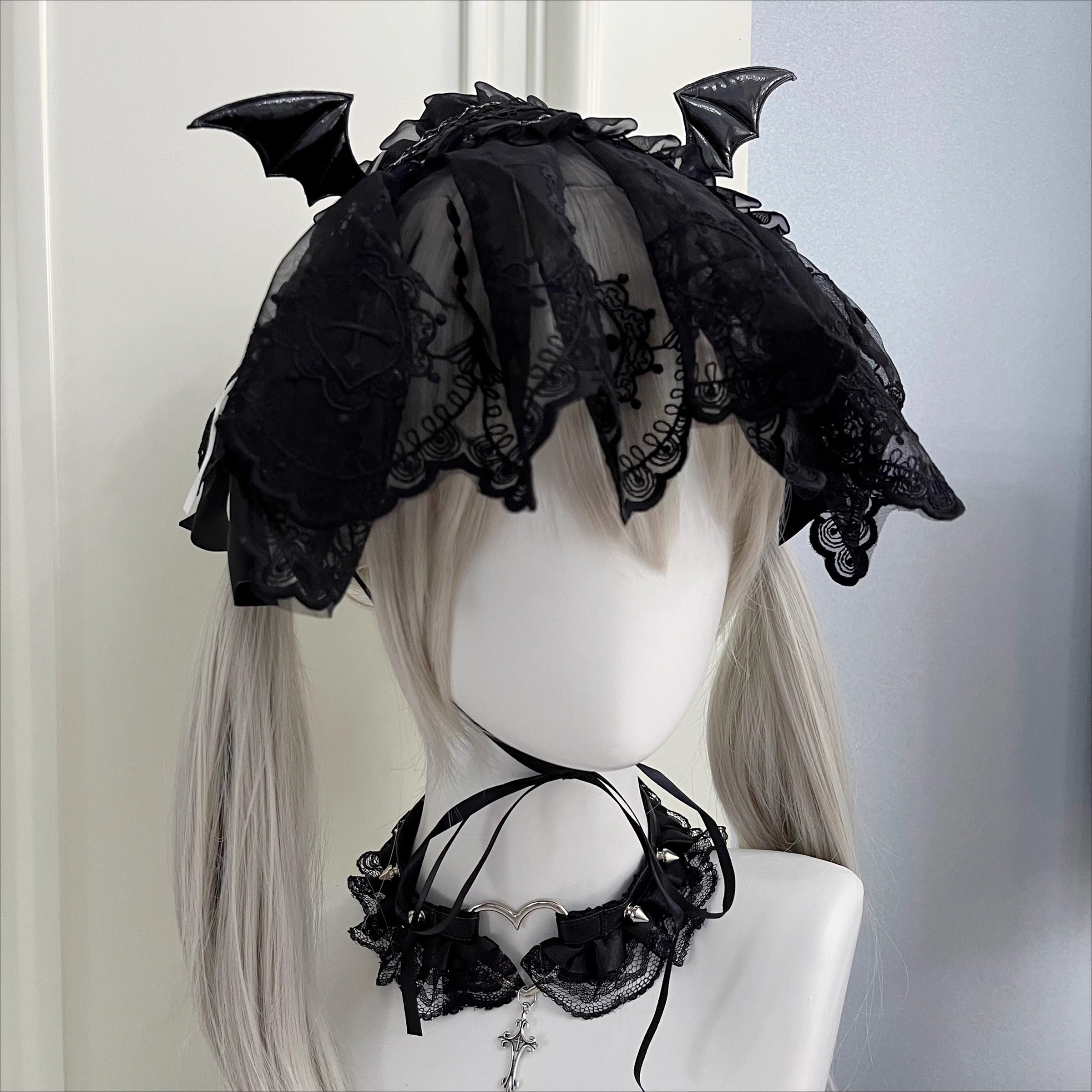 This piece fuses sacred symbolism with a dark, subversive aesthetic. The design combines intricate lace, a dramatic veil, and subtle demonic accents to create a powerful statement. It empowers the wearer to explore themes of rebellion and dark romance, perfect for Gothic Lolita fashion, expressive subculture, and unforgettable Halloween personas. It’s more than an accessory; it’s a narrative.