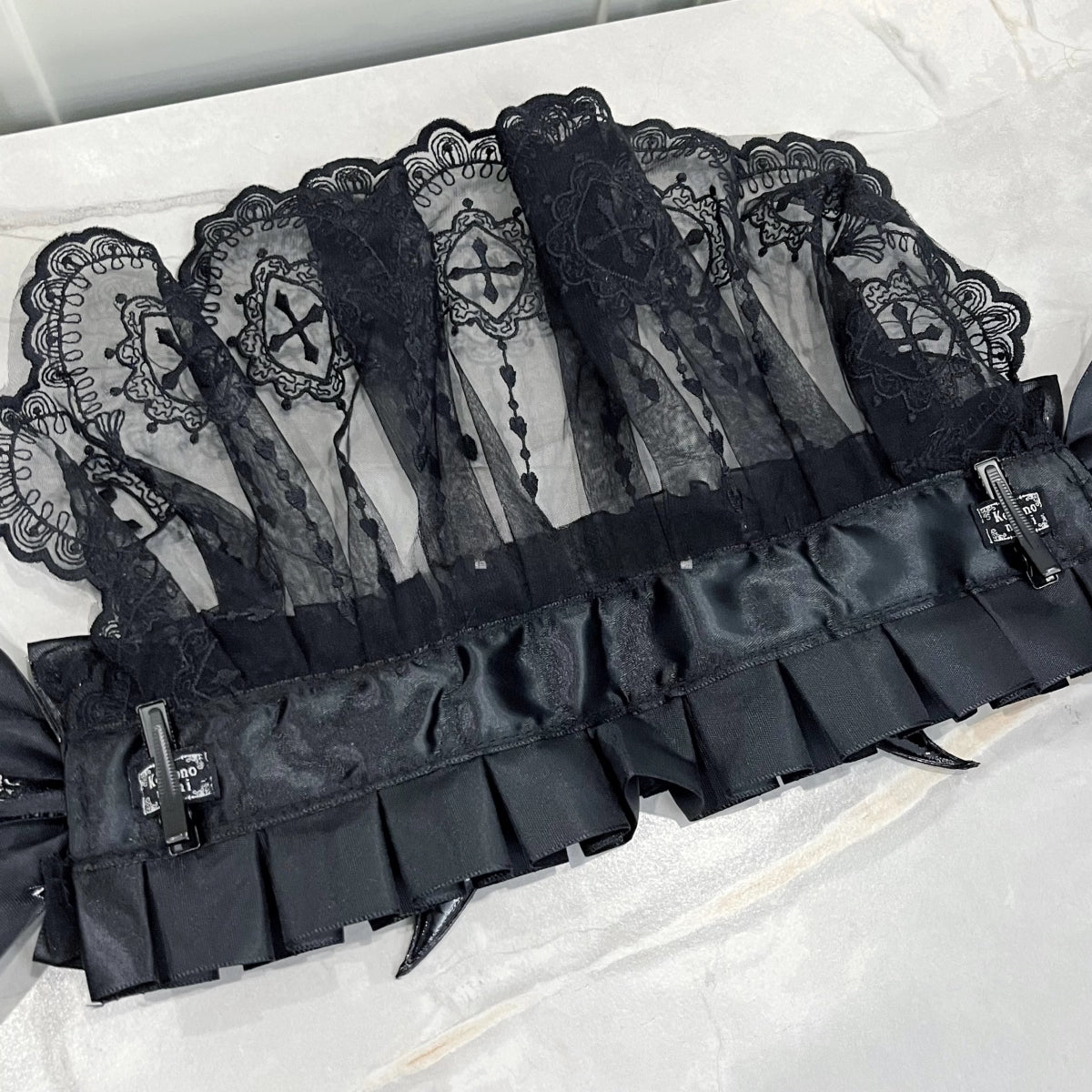 This piece fuses sacred symbolism with a dark, subversive aesthetic. The design combines intricate lace, a dramatic veil, and subtle demonic accents to create a powerful statement. It empowers the wearer to explore themes of rebellion and dark romance, perfect for Gothic Lolita fashion, expressive subculture, and unforgettable Halloween personas. It’s more than an accessory; it’s a narrative.