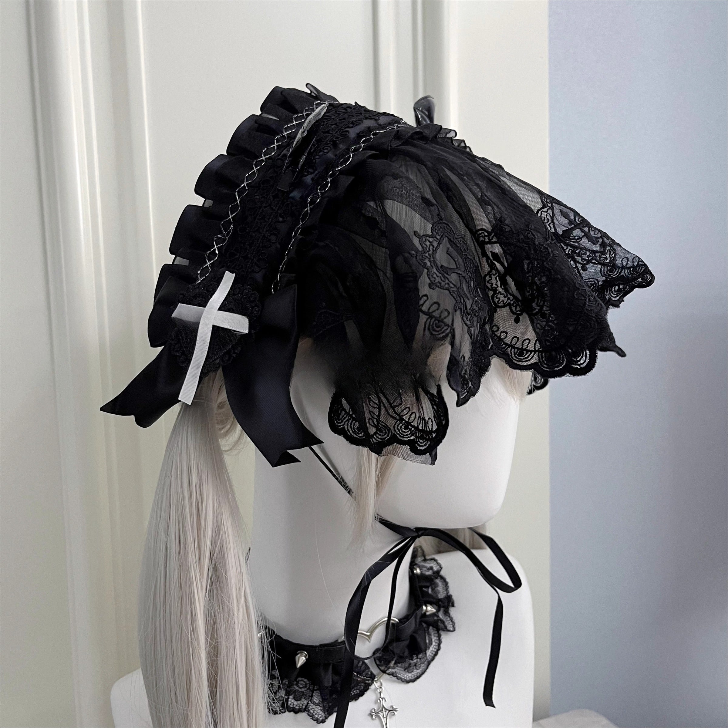 This piece fuses sacred symbolism with a dark, subversive aesthetic. The design combines intricate lace, a dramatic veil, and subtle demonic accents to create a powerful statement. It empowers the wearer to explore themes of rebellion and dark romance, perfect for Gothic Lolita fashion, expressive subculture, and unforgettable Halloween personas. It’s more than an accessory; it’s a narrative.