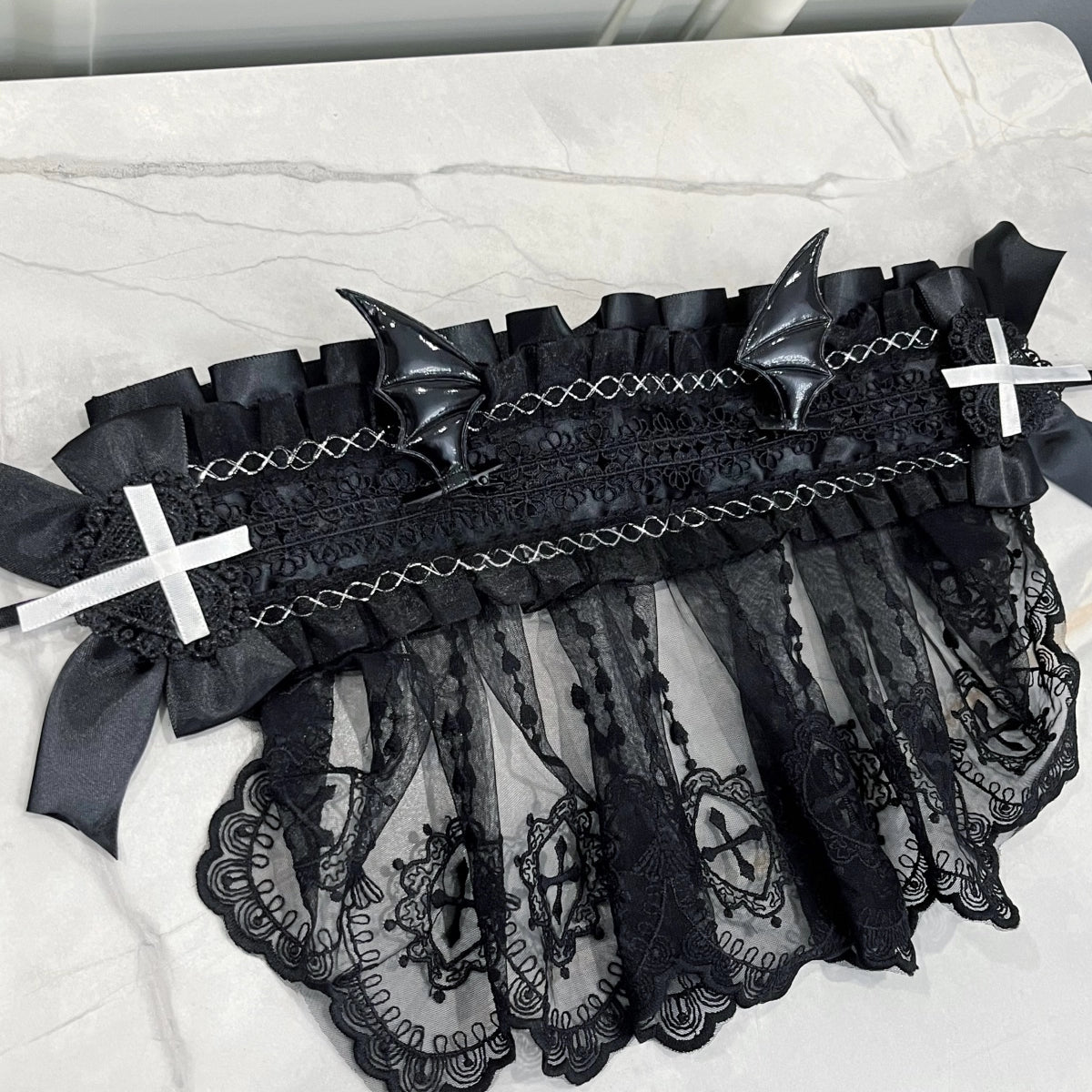 This piece fuses sacred symbolism with a dark, subversive aesthetic. The design combines intricate lace, a dramatic veil, and subtle demonic accents to create a powerful statement. It empowers the wearer to explore themes of rebellion and dark romance, perfect for Gothic Lolita fashion, expressive subculture, and unforgettable Halloween personas. It’s more than an accessory; it’s a narrative.
