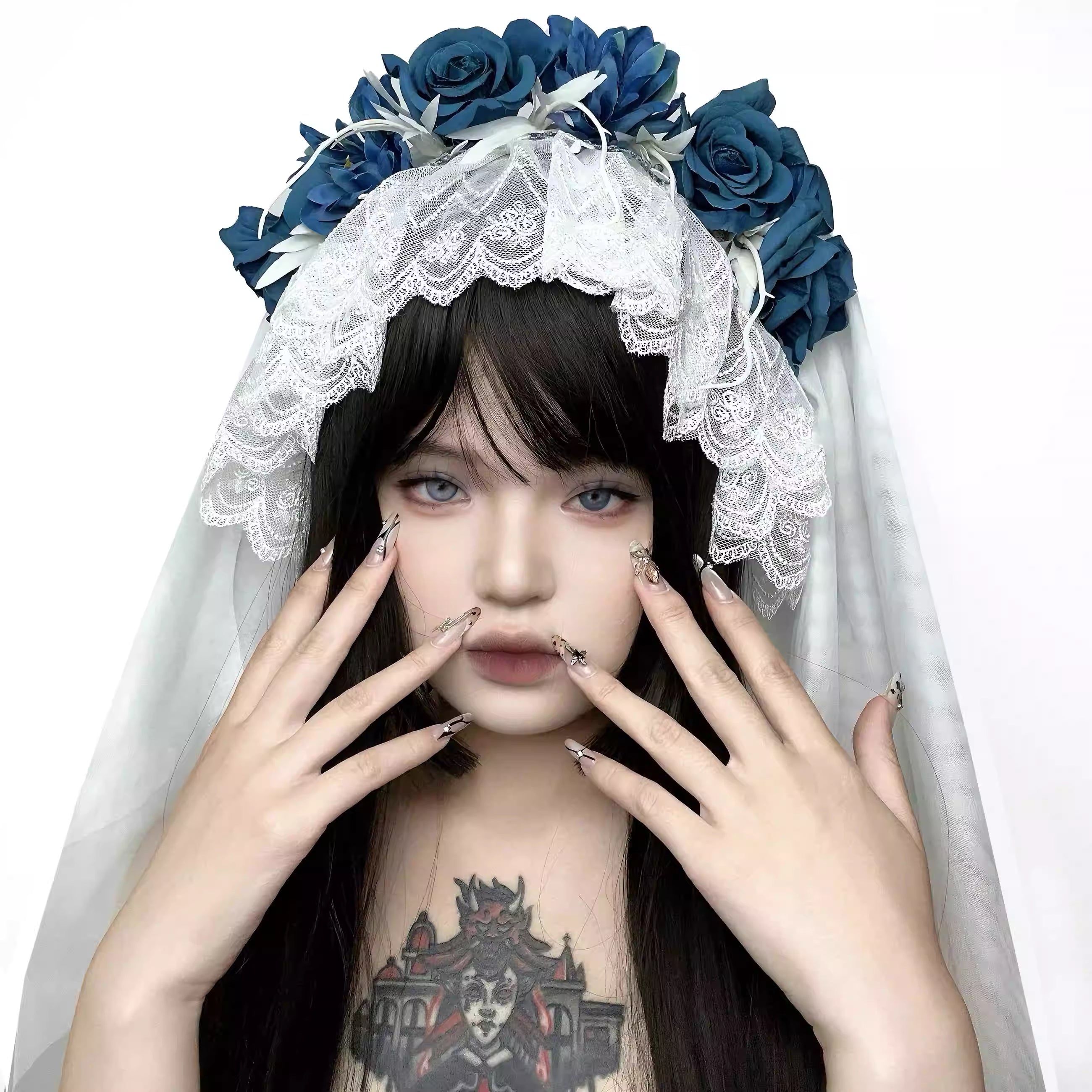 This veil is a masterpiece of subculture storytelling, blending macabre romance with industrial punk aesthetics. Intricate lace forms a decaying, beautiful base, while stark, industrial-style elements clash with soft, tattered edges. The centerpiece is a bold arrangement of black roses, symbolizing love in eternity. Designed for the fearless individual, it transcends convention for photoshoots, alternative weddings, and Halloween, embodying a beauty that is both dark and profoundly romantic.