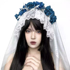 This veil is a masterpiece of subculture storytelling, blending macabre romance with industrial punk aesthetics. Intricate lace forms a decaying, beautiful base, while stark, industrial-style elements clash with soft, tattered edges. The centerpiece is a bold arrangement of black roses, symbolizing love in eternity. Designed for the fearless individual, it transcends convention for photoshoots, alternative weddings, and Halloween, embodying a beauty that is both dark and profoundly romantic.
