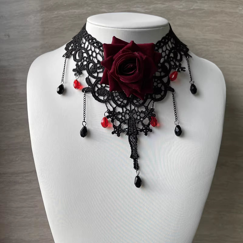 This gothic vampire Lolita choker is designed with lace, roses, and delicate tassels for a dramatic Halloween look. The striking blood drop pendant adds mystery and dark romance, while the vintage details highlight Lolita elegance. Perfect for cosplay, themed parties, or alternative fashion styling, this accessory captures the essence of gothic beauty with a hauntingly alluring charm.