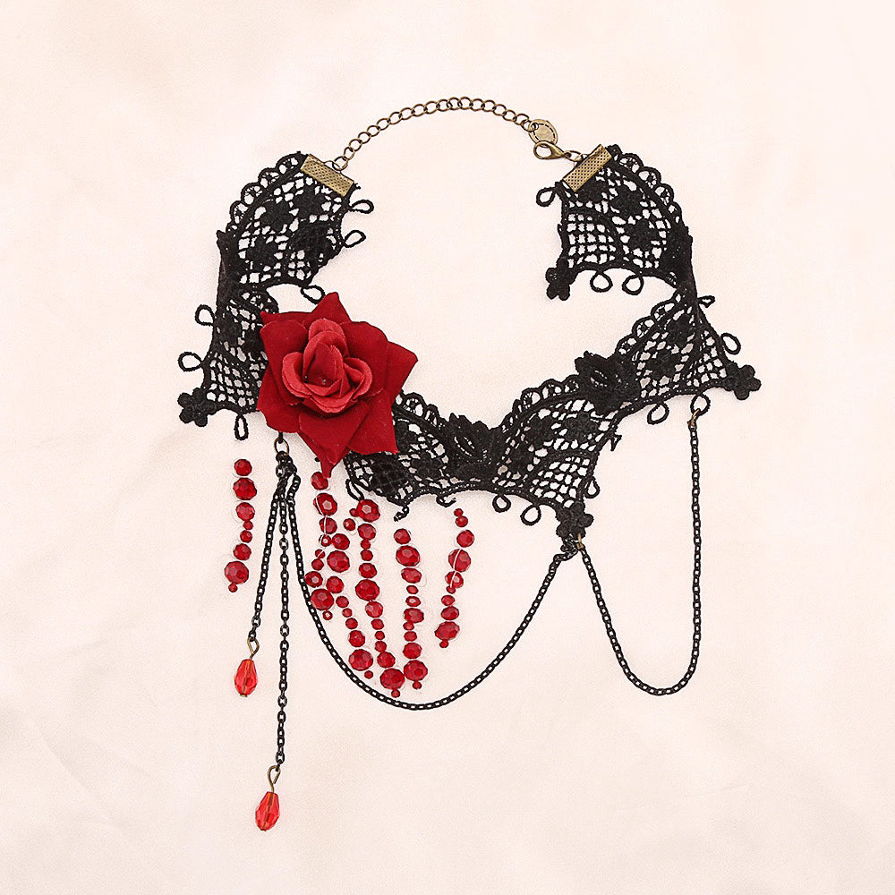 This gothic vampire Lolita choker is designed with lace, roses, and delicate tassels for a dramatic Halloween look. The striking blood drop pendant adds mystery and dark romance, while the vintage details highlight Lolita elegance. Perfect for cosplay, themed parties, or alternative fashion styling, this accessory captures the essence of gothic beauty with a hauntingly alluring charm.