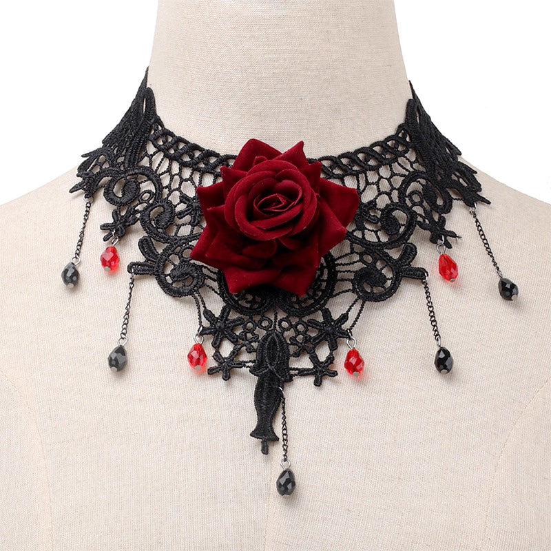 This gothic vampire Lolita choker is designed with lace, roses, and delicate tassels for a dramatic Halloween look. The striking blood drop pendant adds mystery and dark romance, while the vintage details highlight Lolita elegance. Perfect for cosplay, themed parties, or alternative fashion styling, this accessory captures the essence of gothic beauty with a hauntingly alluring charm.