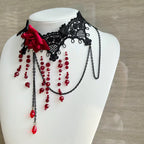 This gothic vampire Lolita choker is designed with lace, roses, and delicate tassels for a dramatic Halloween look. The striking blood drop pendant adds mystery and dark romance, while the vintage details highlight Lolita elegance. Perfect for cosplay, themed parties, or alternative fashion styling, this accessory captures the essence of gothic beauty with a hauntingly alluring charm.