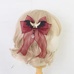 This gothic Lolita witch hat headband is crafted for a playful yet mysterious Halloween style. Designed with bat and demon elements, it combines dark fantasy with Lolita elegance. The mini top hat detail adds vintage charm, while the versatile clip design makes it easy to wear. Perfect for cosplay, themed parties, or photo shoots, it completes any enchanting outfit.