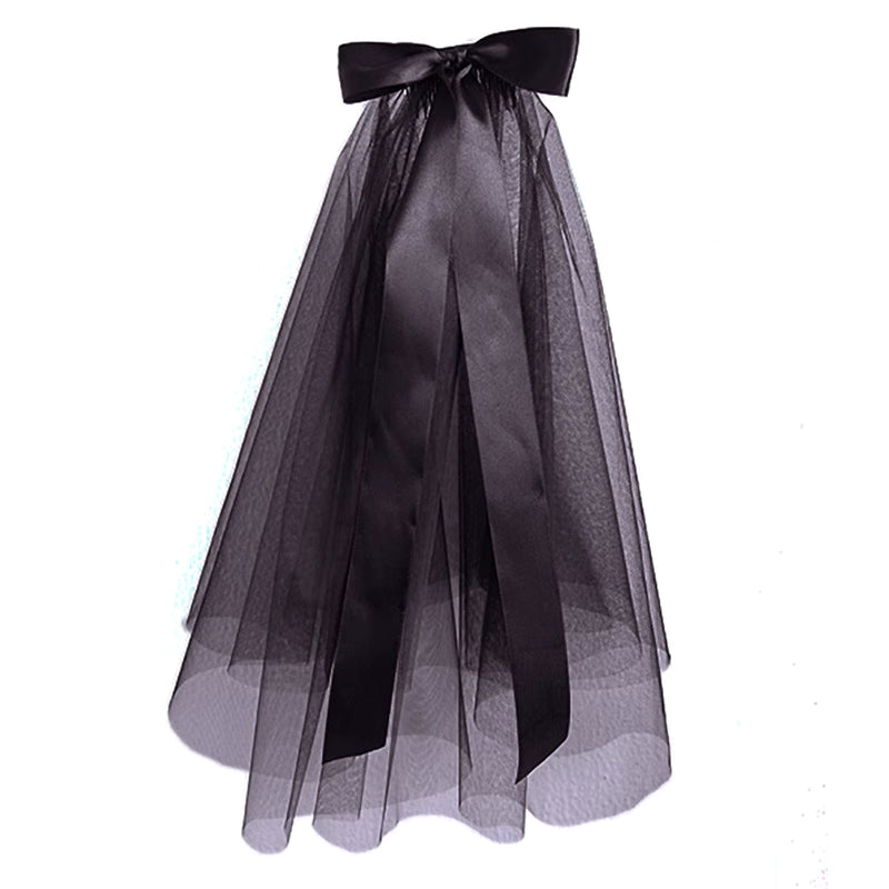 This short gothic bride veil is designed for a mysterious and dramatic Halloween style. Featuring a large bow with flowing ribbons, it blends vintage elegance with dark fantasy. The veil creates a ghostly yet stylish look, perfect for cosplay, themed parties, or photo shoots. A striking accessory that transforms any outfit into a hauntingly beautiful statement.