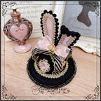 The Eternal Rose handmade accessory set combines playful bunny ears with a charming mini top hat hair clip, crafted for a whimsical Lolita look. Designed with gothic elegance and festive Halloween flair, it balances sweetness with dramatic fantasy. Perfect for cosplay, themed parties, or photo shoots, this set offers versatile styling that enhances Lolita fashion with originality and charm.