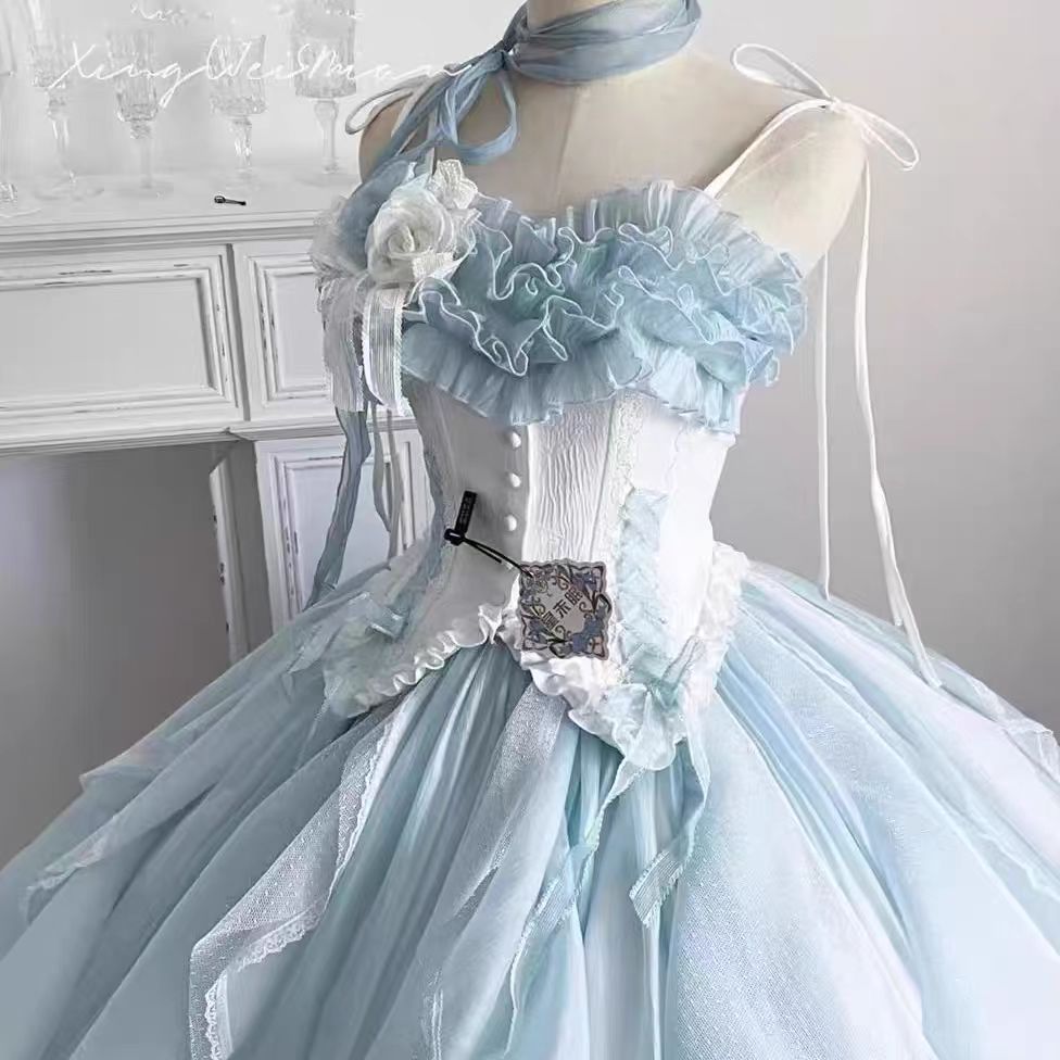 The Blue Evening Princess Dress is designed to capture ethereal beauty and timeless elegance. Crafted in a flowing silhouette with delicate details, it radiates a dreamy, fairytale-like charm. The soft blue tone highlights sophistication while adding a touch of romance, making it perfect for formal events, banquets, or special occasions. This gown blends grace and modern femininity, allowing the wearer to embody both confidence and princess-like allure.