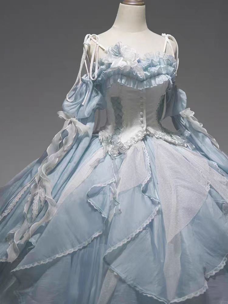 The Blue Evening Princess Dress is designed to capture ethereal beauty and timeless elegance. Crafted in a flowing silhouette with delicate details, it radiates a dreamy, fairytale-like charm. The soft blue tone highlights sophistication while adding a touch of romance, making it perfect for formal events, banquets, or special occasions. This gown blends grace and modern femininity, allowing the wearer to embody both confidence and princess-like allure.