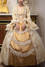 This dress is a tribute to the opulence of history, weaving together the grandeur of medieval courts and the refinement of Victorian elegance. Meticulous gold embroidery evokes royal craftsmanship, while the structured silhouette and lavish details—from lace trims to cascading skirts—celebrate timeless luxury. Designed for modern dreamers, it bridges centuries of artistry, allowing the wearer to embody a narrative where fantasy and heritage dance in harmonious splendor.