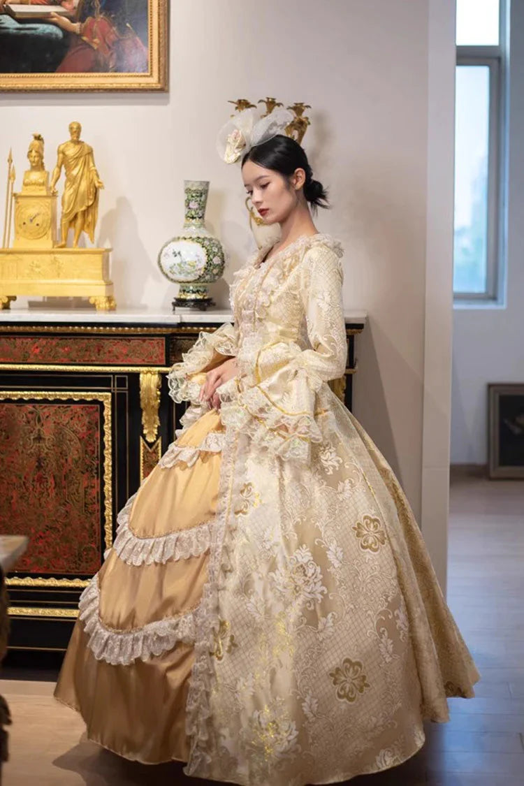 This dress is a tribute to the opulence of history, weaving together the grandeur of medieval courts and the refinement of Victorian elegance. Meticulous gold embroidery evokes royal craftsmanship, while the structured silhouette and lavish details—from lace trims to cascading skirts—celebrate timeless luxury. Designed for modern dreamers, it bridges centuries of artistry, allowing the wearer to embody a narrative where fantasy and heritage dance in harmonious splendor.