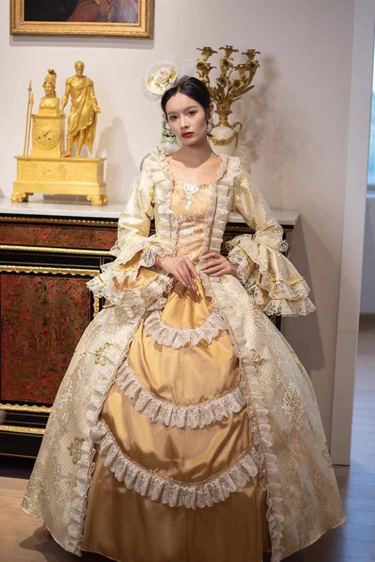 This dress is a tribute to the opulence of history, weaving together the grandeur of medieval courts and the refinement of Victorian elegance. Meticulous gold embroidery evokes royal craftsmanship, while the structured silhouette and lavish details—from lace trims to cascading skirts—celebrate timeless luxury. Designed for modern dreamers, it bridges centuries of artistry, allowing the wearer to embody a narrative where fantasy and heritage dance in harmonious splendor.