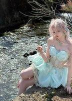 Embrace enchantment in this Green Fairy Lolita JSK. The delicate sleeveless design features a graceful fishbone corset bodice adorned with lustrous pearls and a elegant satin bowknot at the bust. Crafted with a sweet princess silhouette, this dreamy dress combines whimsical charm with timeless elegance. Perfect for creating a magical and romantic Lolita fashion statement.