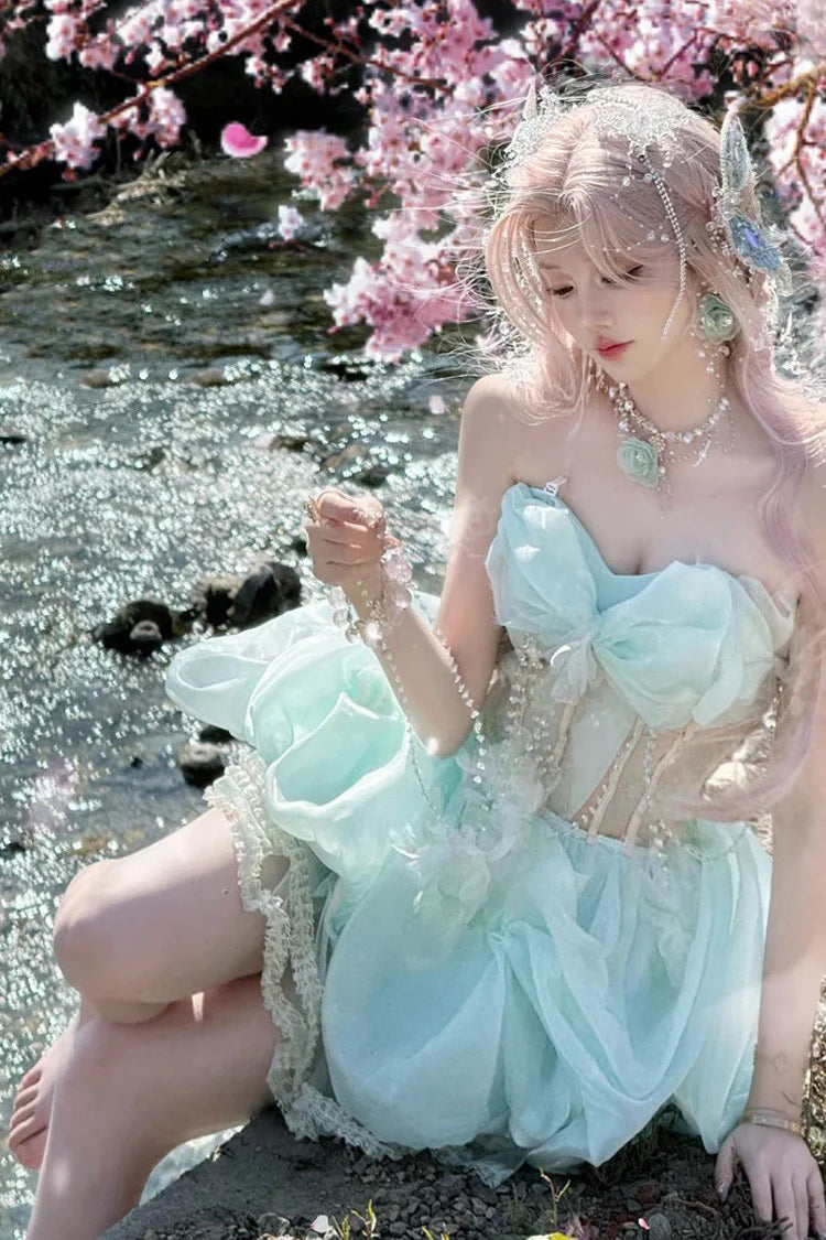 Embrace enchantment in this Green Fairy Lolita JSK. The delicate sleeveless design features a graceful fishbone corset bodice adorned with lustrous pearls and a elegant satin bowknot at the bust. Crafted with a sweet princess silhouette, this dreamy dress combines whimsical charm with timeless elegance. Perfect for creating a magical and romantic Lolita fashion statement.