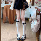 Inspired by the delicate aesthetic of Japanese Lolita fashion, these crew socks blend innocence with elegant charm. Soft lace trims and a delicate bow ribbon tie detail create a playful yet refined statement, perfect for adding a touch of kawaii sweetness to any outfit. Designed for comfort and style, they capture the dreamy, romantic essence of Harajuku street culture.