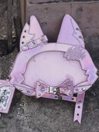 Design Concept:

This bag playfully merges Gothic mystery with feline charm, inspired by the enigmatic elegance of black cats and Victorian-era curiosities. The cat ear design adds a touch of playful rebellion, while the bow and print details balance sweetness and shadow, creating a piece that feels both mischievous and refined.