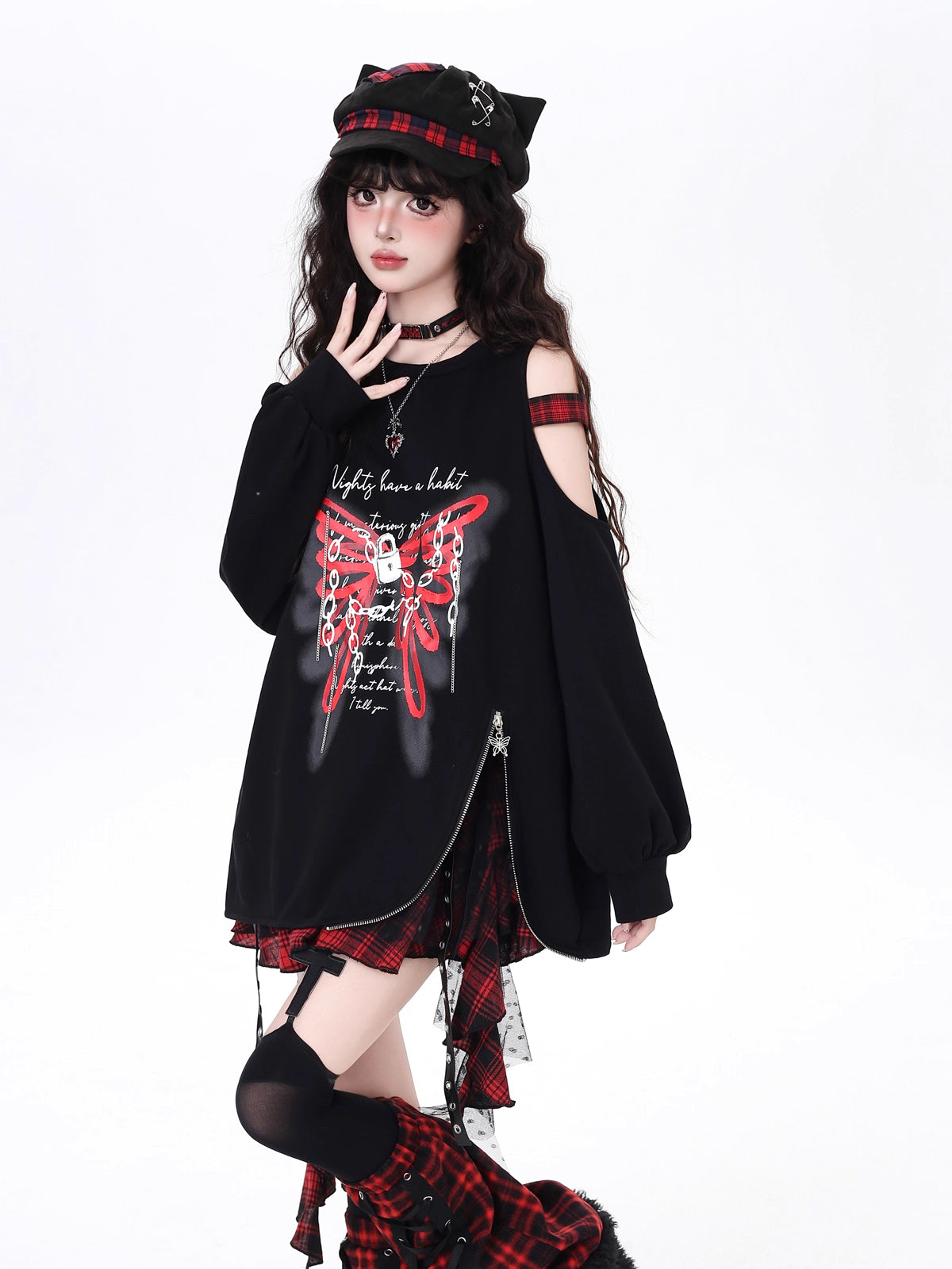 Edgy and feminine, this cropped hoodie features an off-shoulder cut and artistic butterfly-inspired detailing. The relaxed fit and asymmetrical hem create a modern silhouette, perfect for layering or wearing solo. Soft yet bold, it’s designed for those who balance delicate charm with urban toughness.