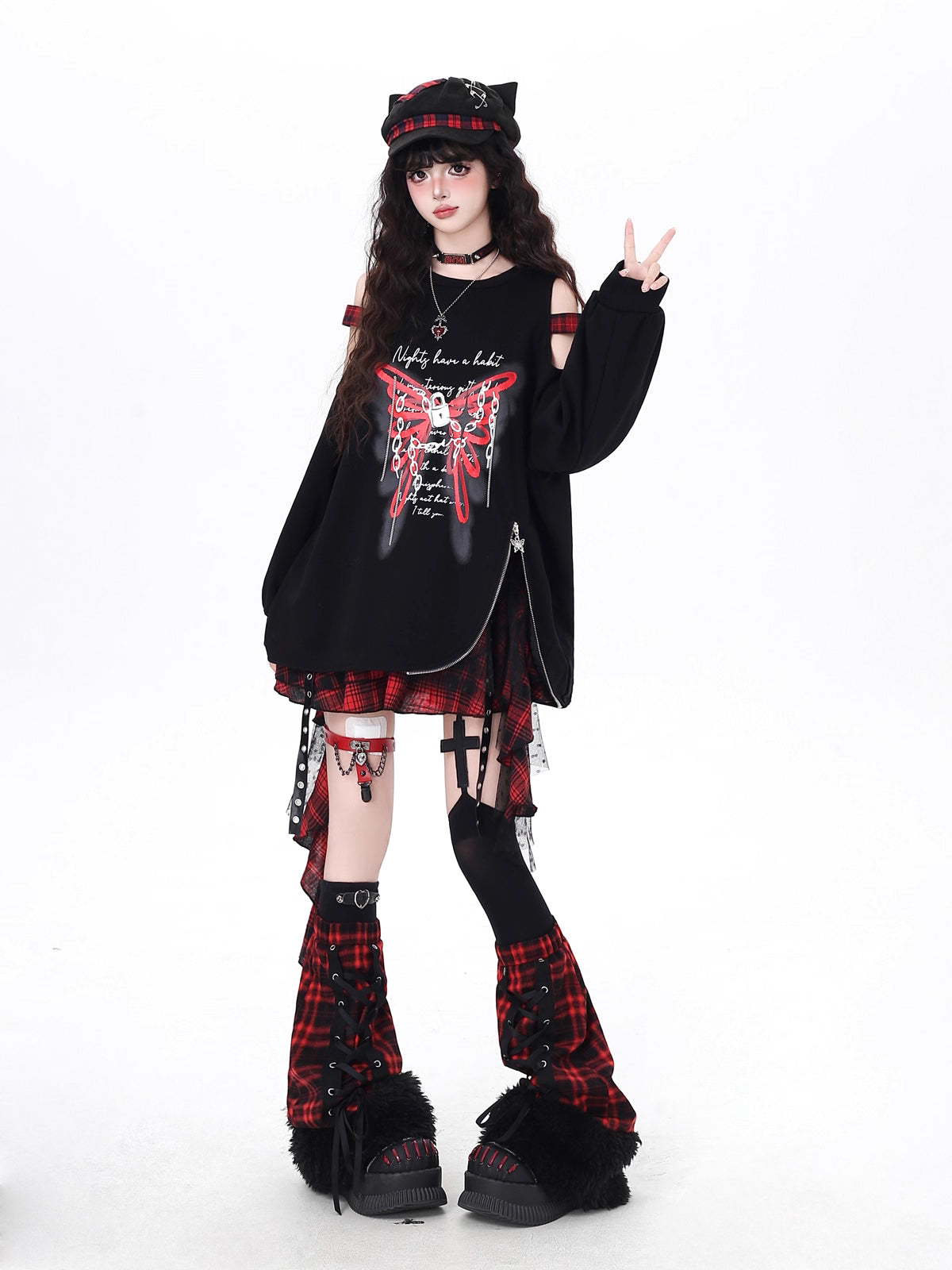 Edgy and feminine, this cropped hoodie features an off-shoulder cut and artistic butterfly-inspired detailing. The relaxed fit and asymmetrical hem create a modern silhouette, perfect for layering or wearing solo. Soft yet bold, it’s designed for those who balance delicate charm with urban toughness.