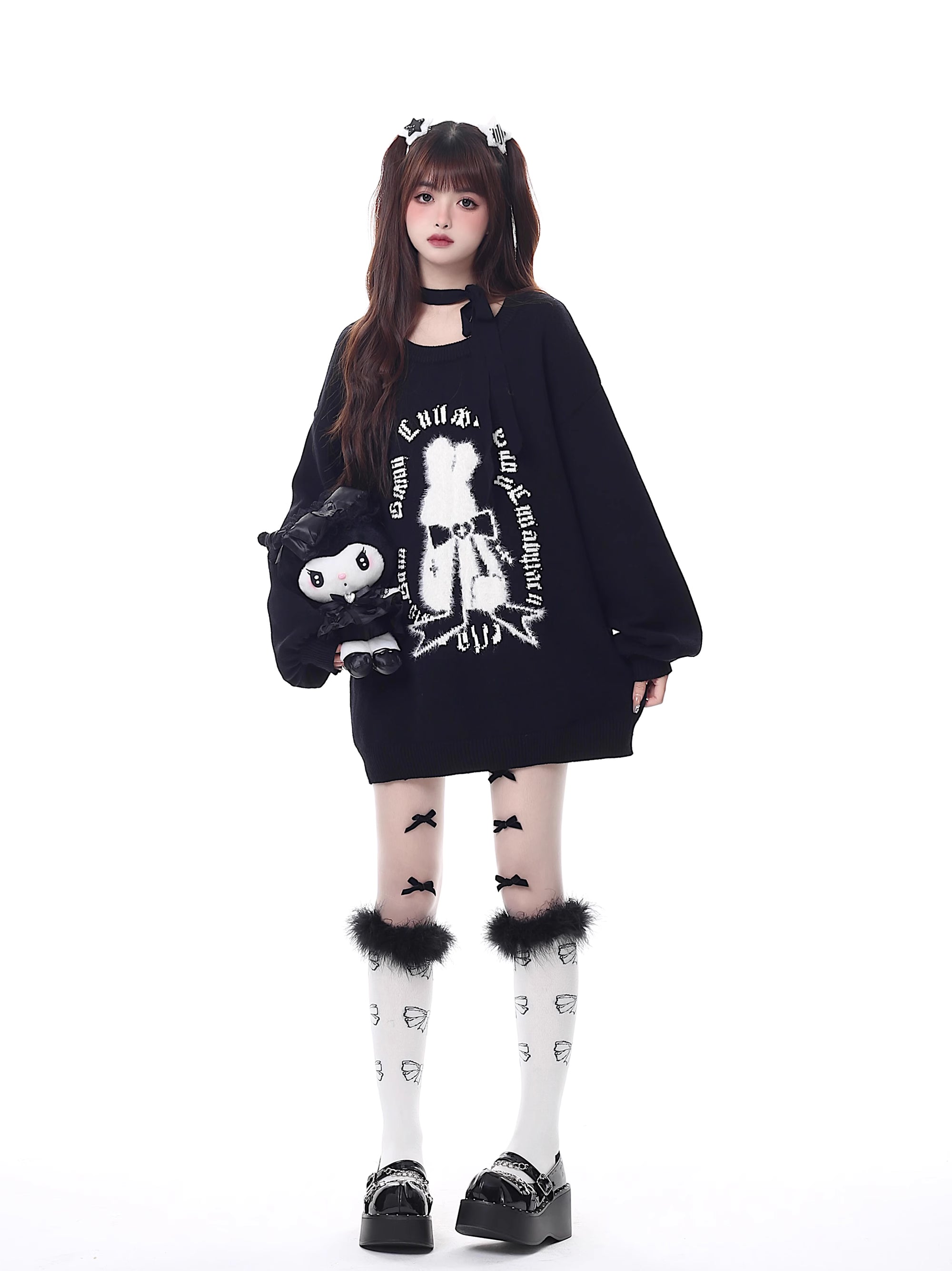 Inspired by a cozy winter's tale, this festive sweater blends a classic Fair Isle pattern with a whimsical rabbit motif. The rich, flattering black and red palette ensures a standout seasonal look. Designed with voluminous lantern sleeves for a touch of vintage charm, it’s the perfect, merry statement piece for holiday cheer and warmth.