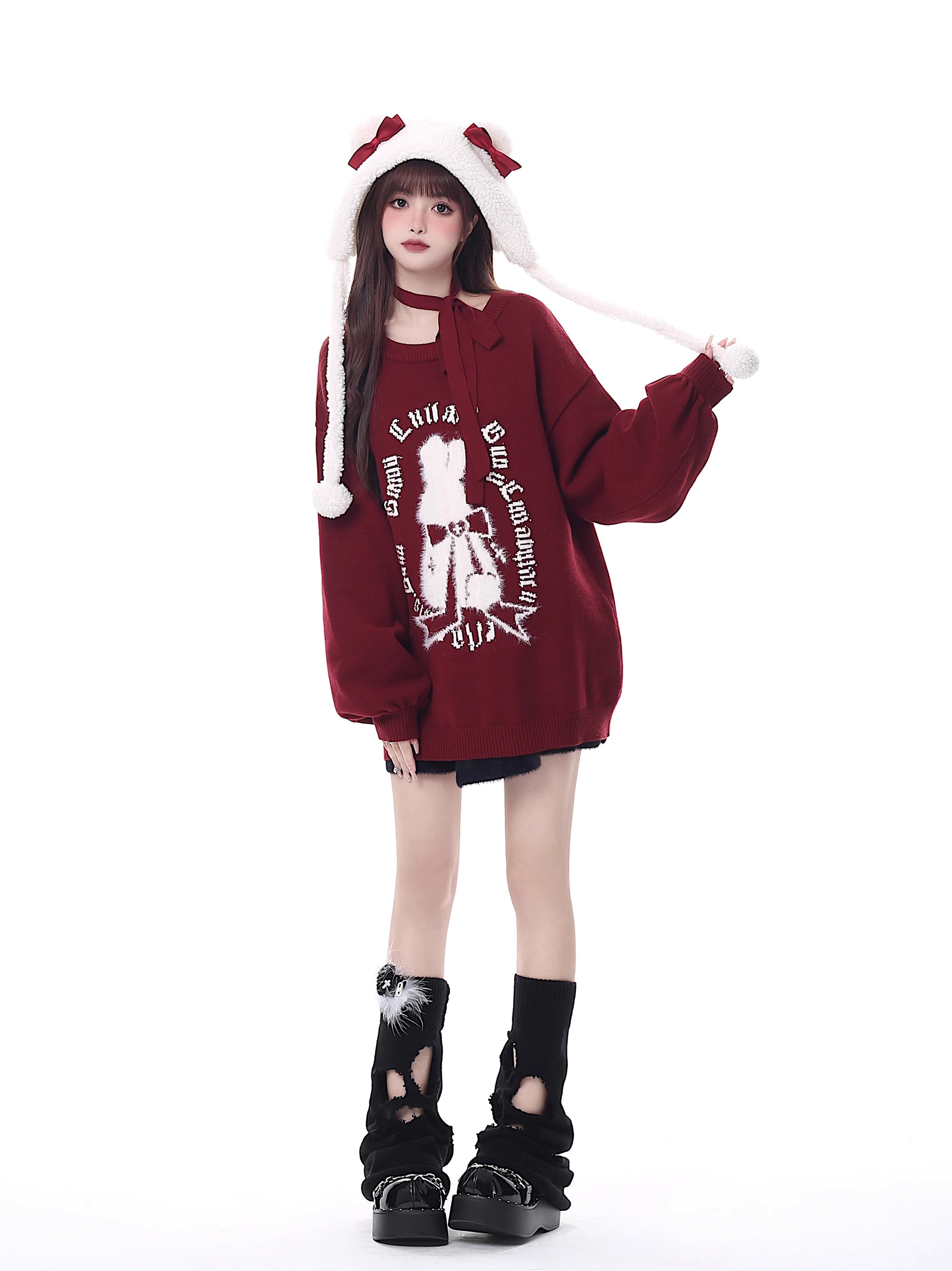 Inspired by a cozy winter's tale, this festive sweater blends a classic Fair Isle pattern with a whimsical rabbit motif. The rich, flattering black and red palette ensures a standout seasonal look. Designed with voluminous lantern sleeves for a touch of vintage charm, it’s the perfect, merry statement piece for holiday cheer and warmth.