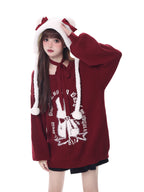 Inspired by a cozy winter's tale, this festive sweater blends a classic Fair Isle pattern with a whimsical rabbit motif. The rich, flattering black and red palette ensures a standout seasonal look. Designed with voluminous lantern sleeves for a touch of vintage charm, it’s the perfect, merry statement piece for holiday cheer and warmth.