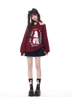 Inspired by a cozy winter's tale, this festive sweater blends a classic Fair Isle pattern with a whimsical rabbit motif. The rich, flattering black and red palette ensures a standout seasonal look. Designed with voluminous lantern sleeves for a touch of vintage charm, it’s the perfect, merry statement piece for holiday cheer and warmth.