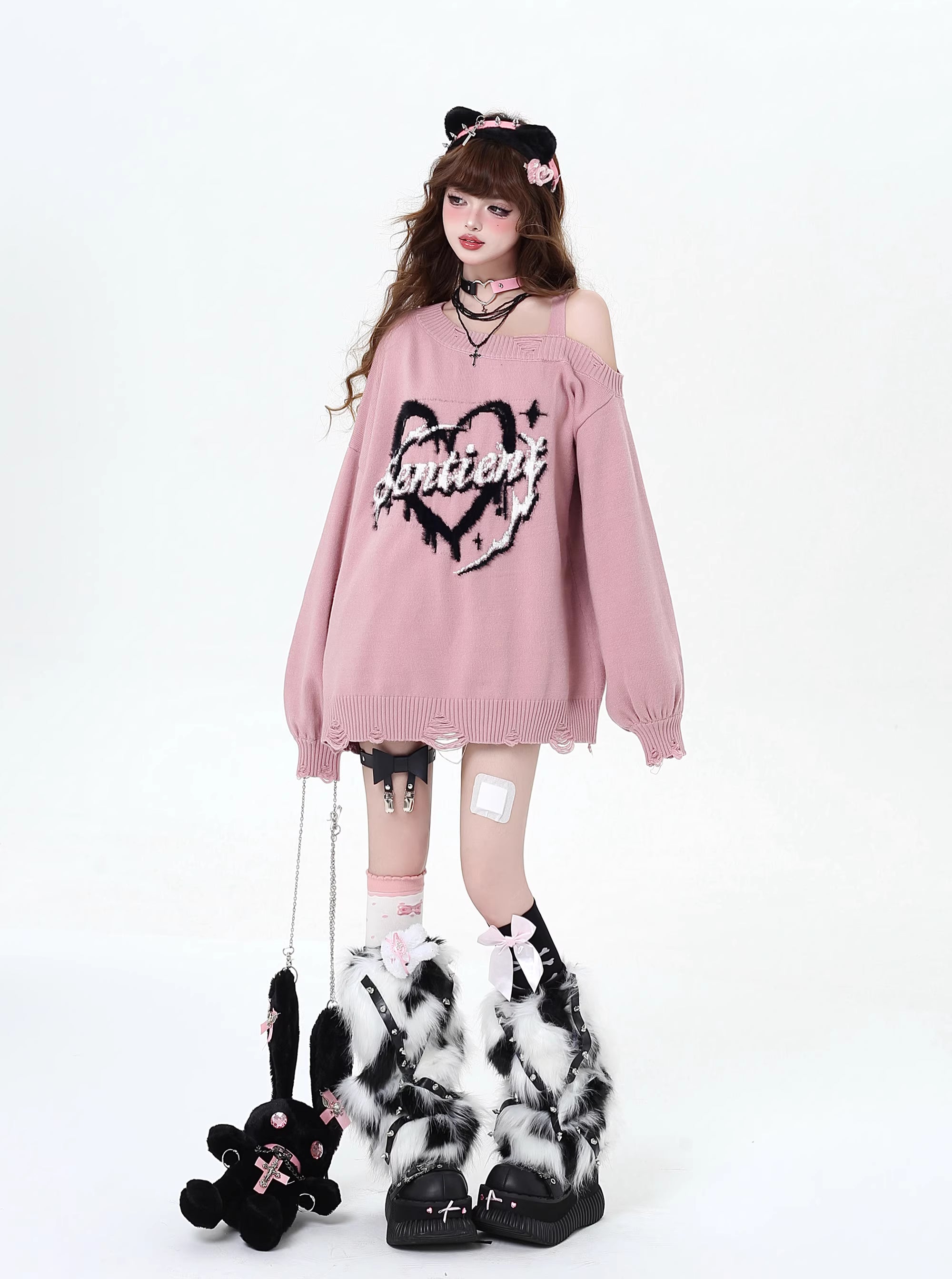 This sweater captures the erratic pulse of youthful emotion with a soft, dropped-shoulder silhouette. The muted blue and pink palette feels both nostalgic and rebellious, perfect for expressing a tender, offbeat identity. It’s a cozy yet bold statement for introverts dreaming in color.