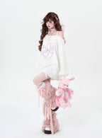 This sweater captures the erratic pulse of youthful emotion with a soft, dropped-shoulder silhouette. The muted blue and pink palette feels both nostalgic and rebellious, perfect for expressing a tender, offbeat identity. It’s a cozy yet bold statement for introverts dreaming in color.