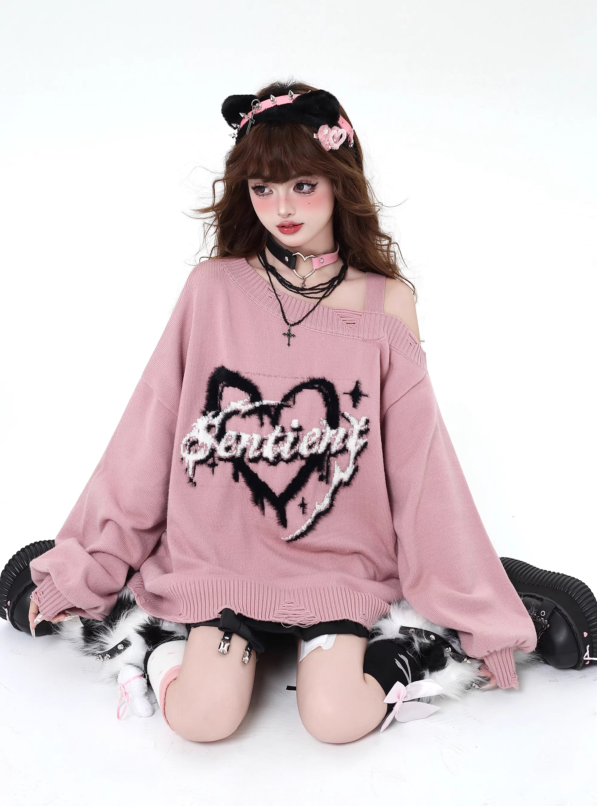 This sweater captures the erratic pulse of youthful emotion with a soft, dropped-shoulder silhouette. The muted blue and pink palette feels both nostalgic and rebellious, perfect for expressing a tender, offbeat identity. It’s a cozy yet bold statement for introverts dreaming in color.