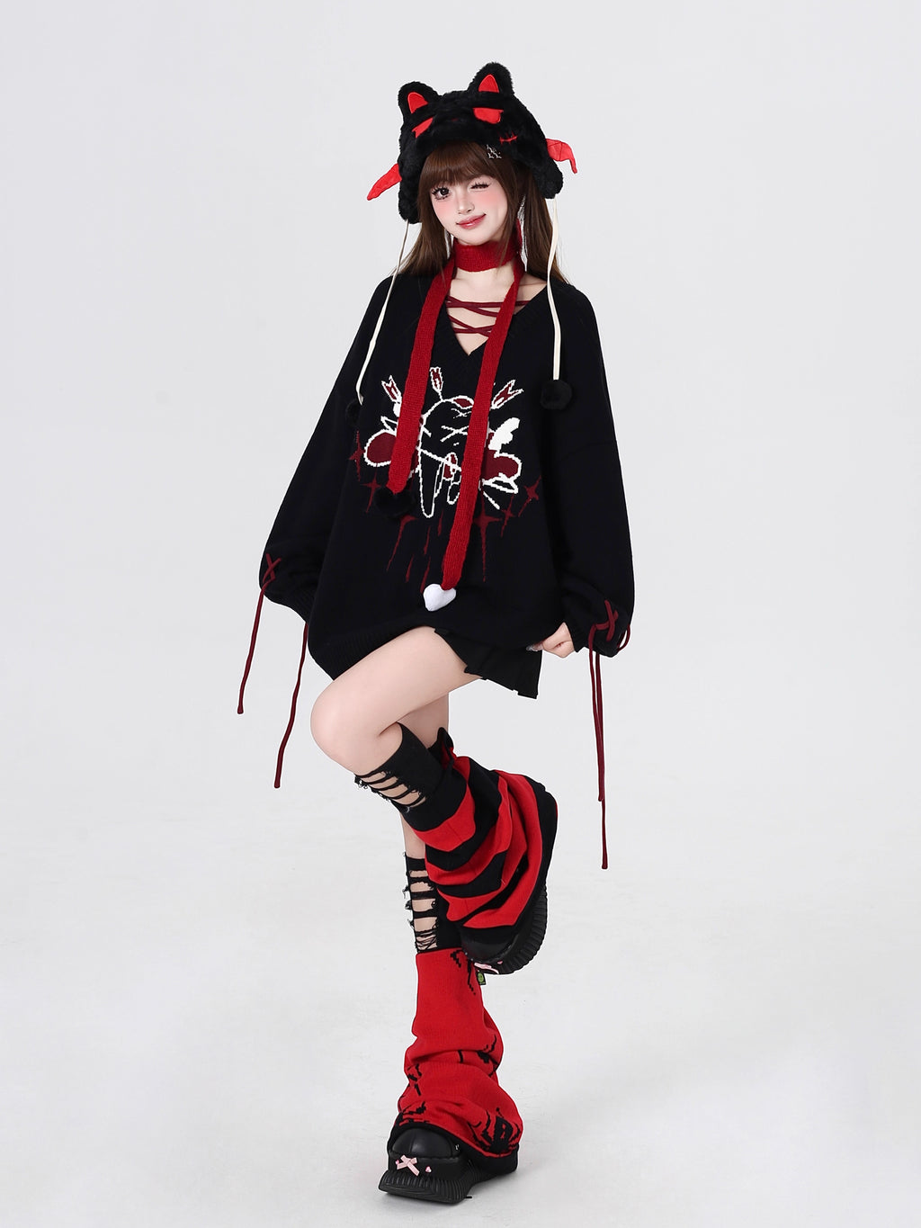 This sweater channels raw, post-breakup emotion into wearable alt-culture art. The bold V-neck and relaxed fit offer effortless cool, while the stark red, black, and white palette screams rebellious elegance. It’s for those who wear their heartbreak like armor—soft on the inside, fiercely unique on the outside.
