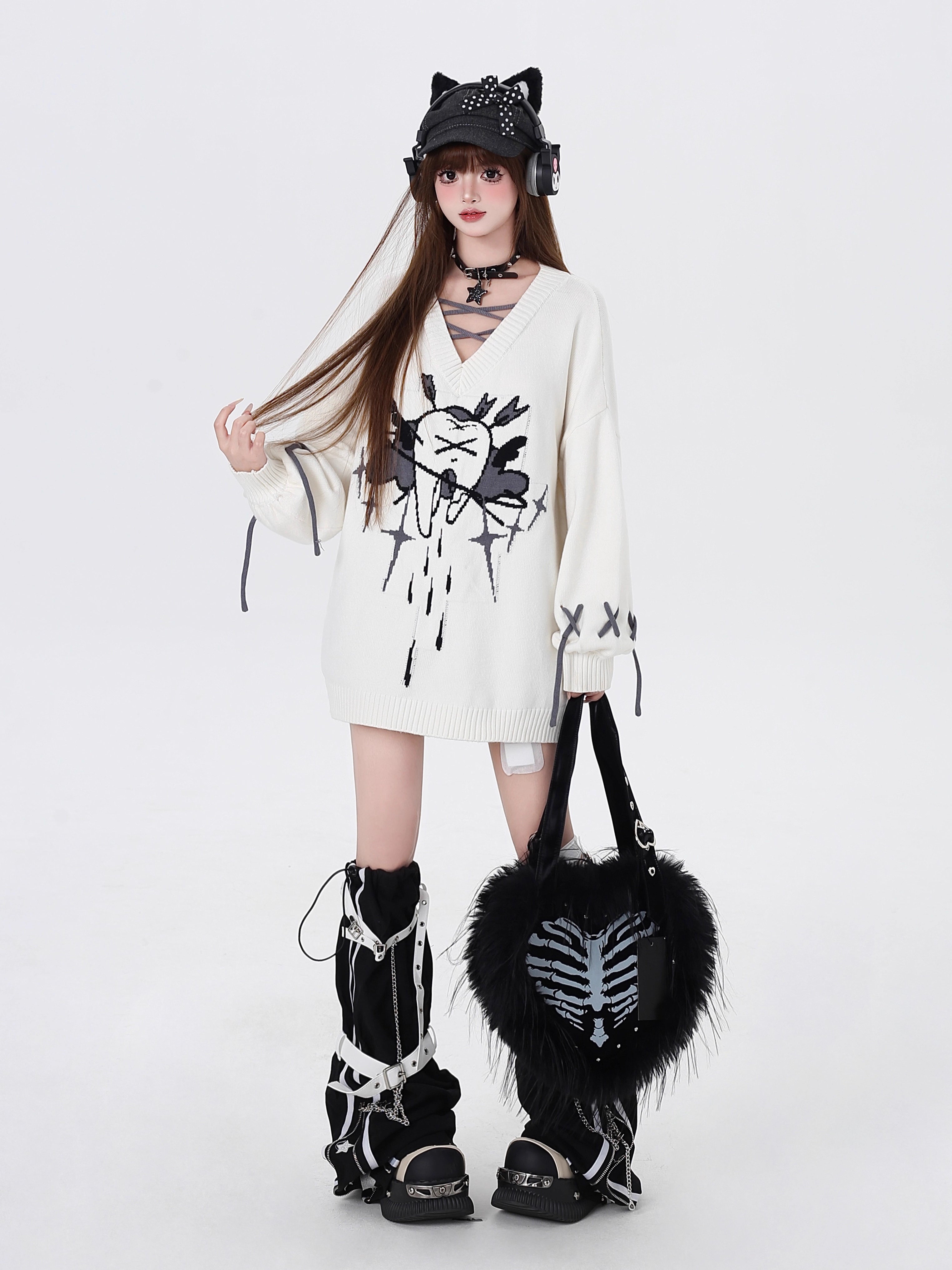 This sweater channels raw, post-breakup emotion into wearable alt-culture art. The bold V-neck and relaxed fit offer effortless cool, while the stark red, black, and white palette screams rebellious elegance. It’s for those who wear their heartbreak like armor—soft on the inside, fiercely unique on the outside.