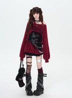 Mixing delicate luxury with downtown edge, this slouchy asymmetric sweater redefines romantic rebellion. Ultra-soft faux fur blends with a provocative off-shoulder cut, while the intense black and red palette whispers passion and defiance. For the dreamer who isn’t afraid to break a few rules.