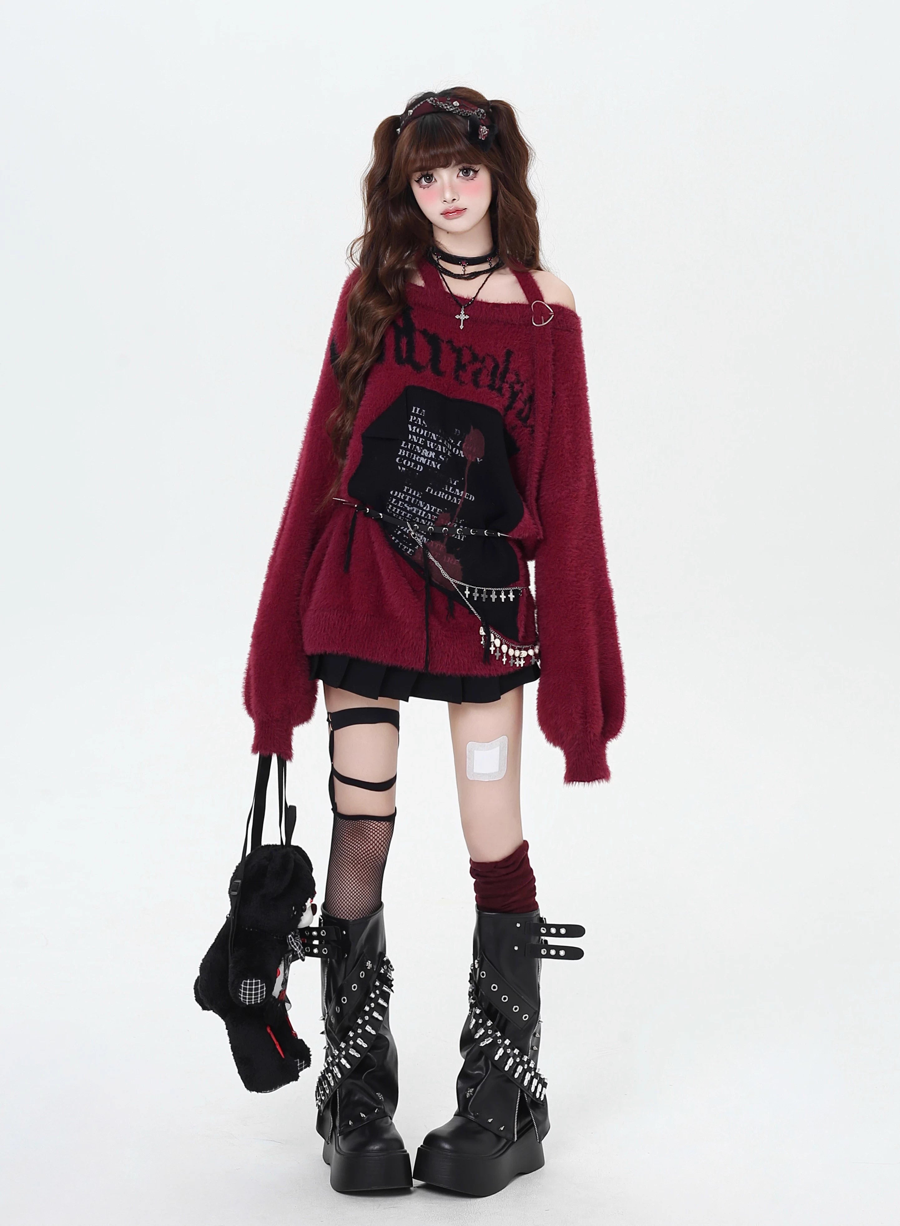 Mixing delicate luxury with downtown edge, this slouchy asymmetric sweater redefines romantic rebellion. Ultra-soft faux fur blends with a provocative off-shoulder cut, while the intense black and red palette whispers passion and defiance. For the dreamer who isn’t afraid to break a few rules.