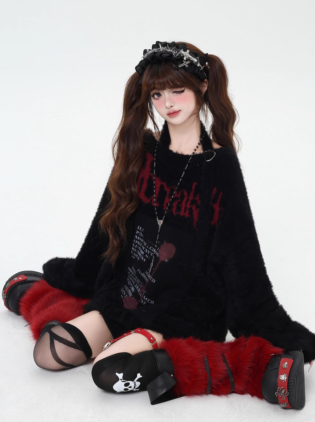 Mixing delicate luxury with downtown edge, this slouchy asymmetric sweater redefines romantic rebellion. Ultra-soft faux fur blends with a provocative off-shoulder cut, while the intense black and red palette whispers passion and defiance. For the dreamer who isn’t afraid to break a few rules.