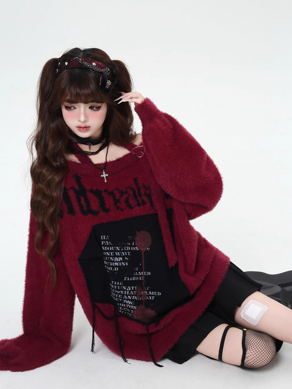 Mixing delicate luxury with downtown edge, this slouchy asymmetric sweater redefines romantic rebellion. Ultra-soft faux fur blends with a provocative off-shoulder cut, while the intense black and red palette whispers passion and defiance. For the dreamer who isn’t afraid to break a few rules.