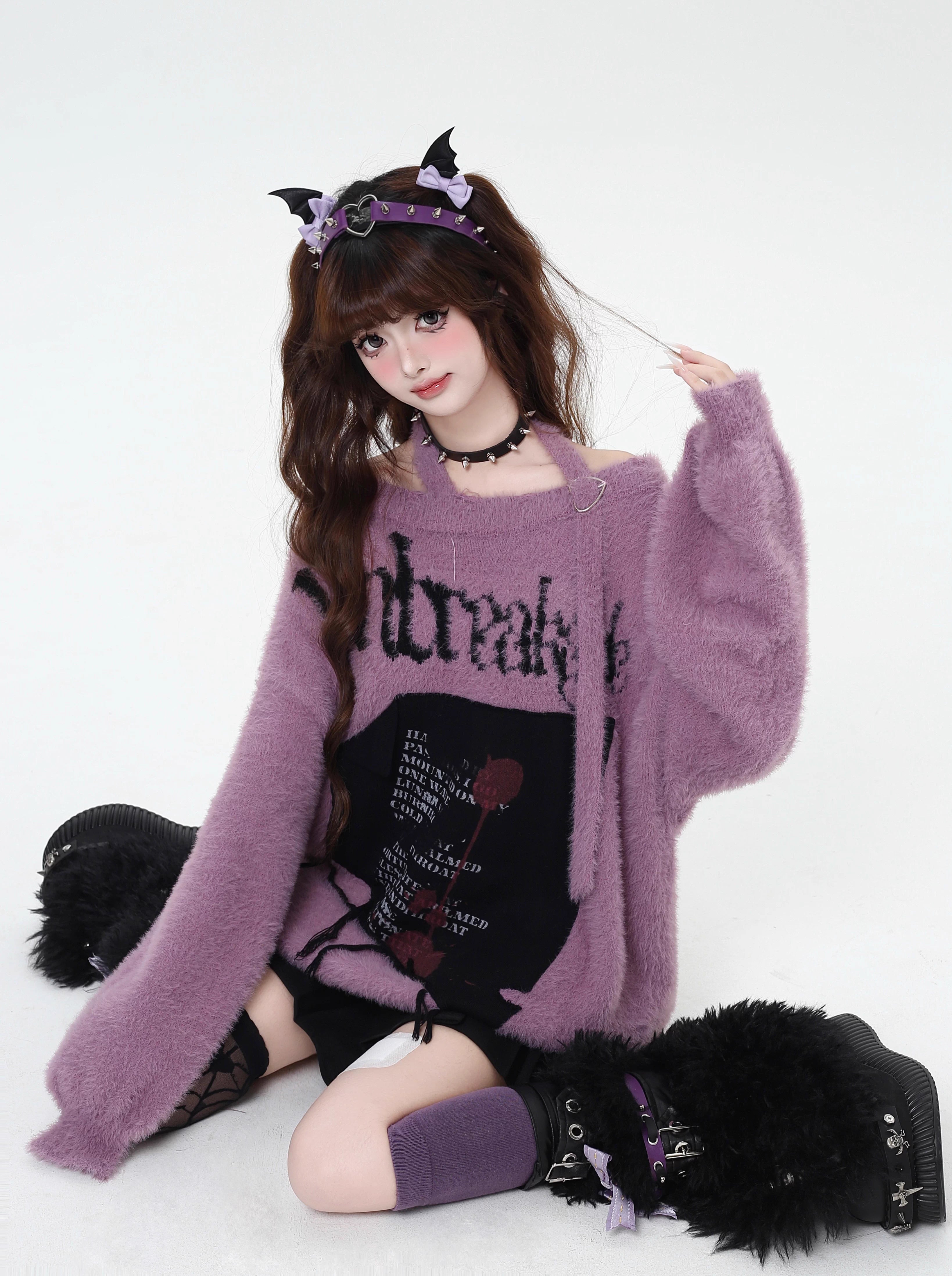 Mixing delicate luxury with downtown edge, this slouchy asymmetric sweater redefines romantic rebellion. Ultra-soft faux fur blends with a provocative off-shoulder cut, while the intense black and red palette whispers passion and defiance. For the dreamer who isn’t afraid to break a few rules.