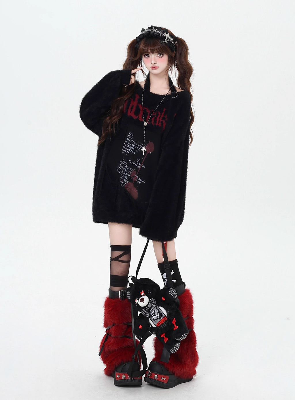Mixing delicate luxury with downtown edge, this slouchy asymmetric sweater redefines romantic rebellion. Ultra-soft faux fur blends with a provocative off-shoulder cut, while the intense black and red palette whispers passion and defiance. For the dreamer who isn’t afraid to break a few rules.