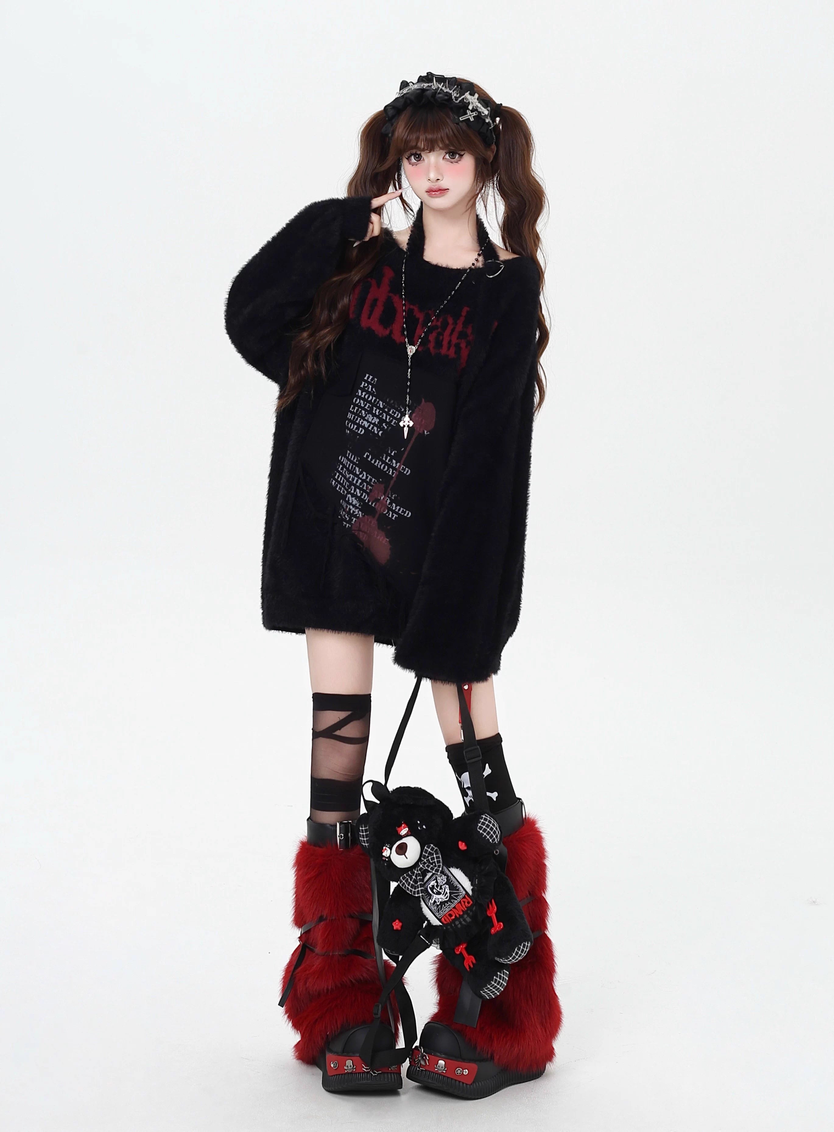 Mixing delicate luxury with downtown edge, this slouchy asymmetric sweater redefines romantic rebellion. Ultra-soft faux fur blends with a provocative off-shoulder cut, while the intense black and red palette whispers passion and defiance. For the dreamer who isn’t afraid to break a few rules.
