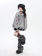 This sweater blends street art energy with bohemian flair. Raw-cut fringe, abstract cartoon graffiti, and an intentionally irregular silhouette create a look that's both playful and rebellious. Soft, slouchy, and effortlessly cool—for those who wear their creativity on their sleeve.