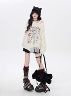 This sweater blends street art energy with bohemian flair. Raw-cut fringe, abstract cartoon graffiti, and an intentionally irregular silhouette create a look that's both playful and rebellious. Soft, slouchy, and effortlessly cool—for those who wear their creativity on their sleeve.