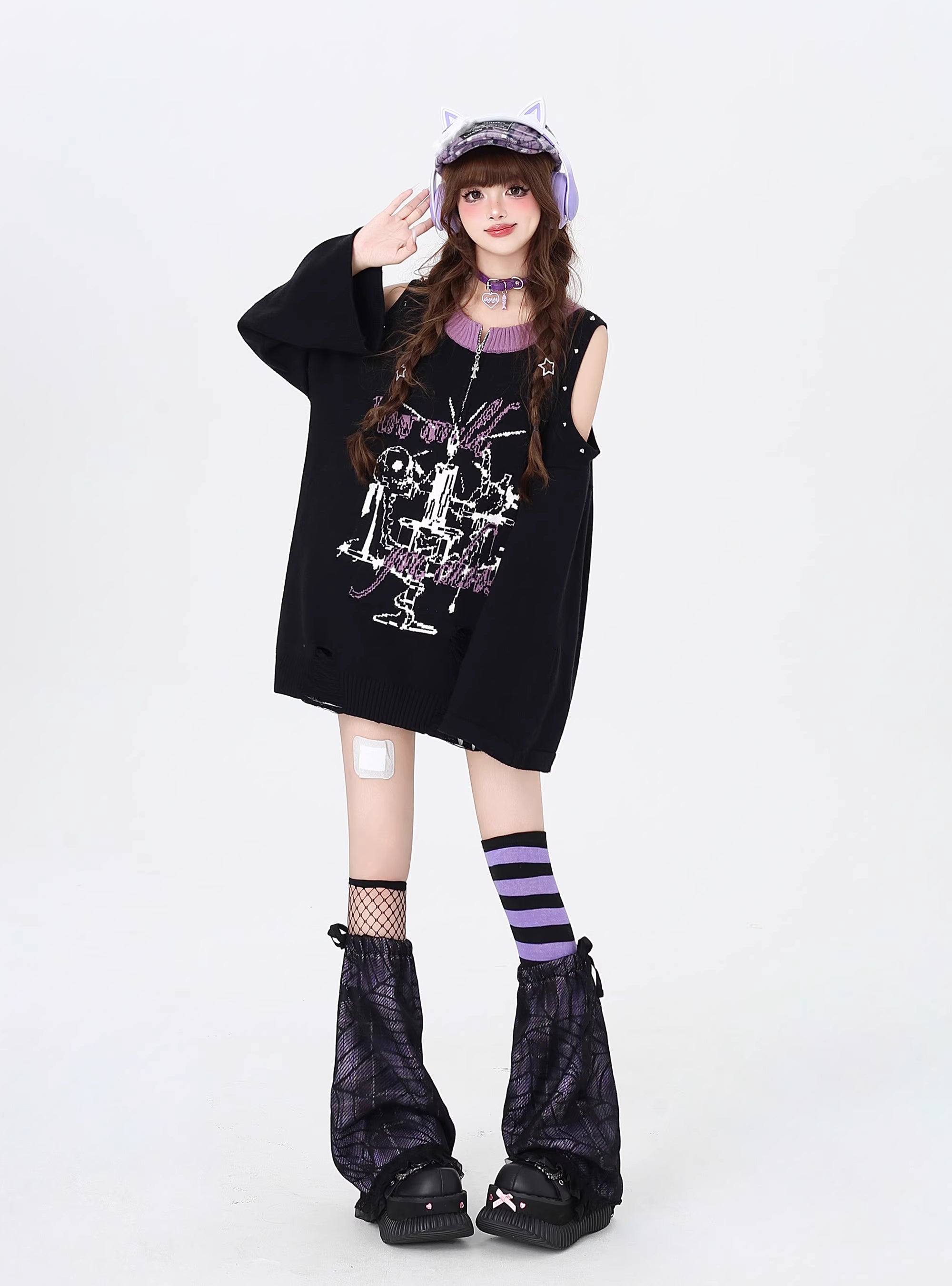 Embrace your inner anti-hero with this edgy, drop-shoulder sweater. Featuring rebellious punk-inspired details and a stark black-and-white palette, it’s designed for those who defy conventions. Soft yet bold, it’s the perfect piece to channel dark romanticism and effortless cool during crisp Winter days.
