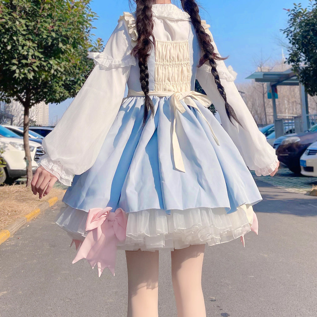 This classic Lolita blouse features a delicate Peter Pan collar and soft bishop sleeves with subtle puff detailing. Rendered in timeless black and white, its accordion pleats and bloom-inspired ruffles add vintage charm to any coordination. The lightweight fabric and tailored fit make it ideal for layering under jumpers or dresses, blending doll-like sweetness with elegant Gothic sophistication for daily wear or special occasions.