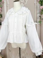 This classic Lolita blouse features a delicate Peter Pan collar and soft bishop sleeves with subtle puff detailing. Rendered in timeless black and white, its accordion pleats and bloom-inspired ruffles add vintage charm to any coordination. The lightweight fabric and tailored fit make it ideal for layering under jumpers or dresses, blending doll-like sweetness with elegant Gothic sophistication for daily wear or special occasions.