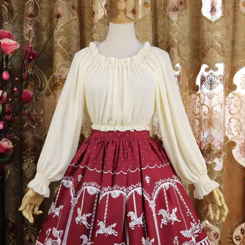 This lightweight chiffon blouse combines a classic round neck with soft puff sleeves for effortless elegance. The flowing fabric and relaxed silhouette offer versatile comfort, perfect for daily layering under jumpers or dresses. Its delicate drape and subtle sheen create a romantic foundation for both sweet and classic Lolita coordinates, blending practicality with dreamy sophistication.