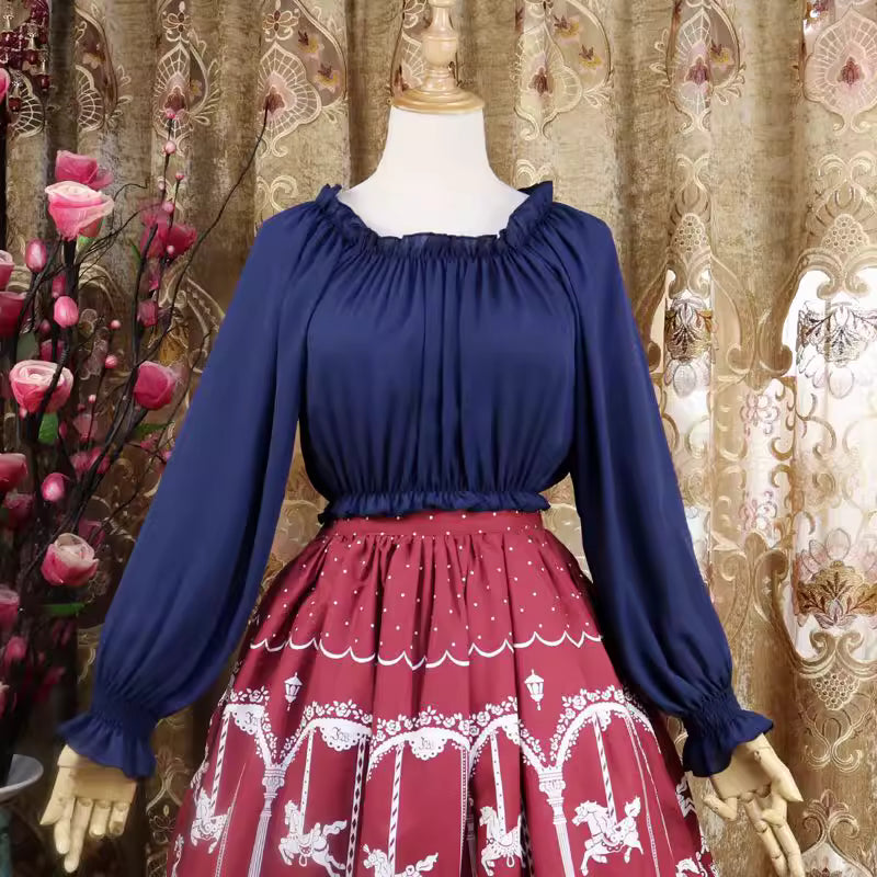This lightweight chiffon blouse combines a classic round neck with soft puff sleeves for effortless elegance. The flowing fabric and relaxed silhouette offer versatile comfort, perfect for daily layering under jumpers or dresses. Its delicate drape and subtle sheen create a romantic foundation for both sweet and classic Lolita coordinates, blending practicality with dreamy sophistication.