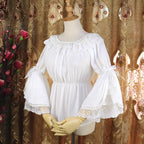 This elegant chiffon blouse features dramatic ruffled sleeves and a delicate bow accent, creating a romantic silhouette. The lightweight fabric drapes softly for effortless layering under jumpers or dresses. With its refined details and flowing texture, it blends vintage-inspired grace with modern Lolita charm, perfect for adding sophistication to any coordinate.