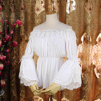 This elegant chiffon blouse features dramatic ruffled sleeves and a delicate bow accent, creating a romantic silhouette. The lightweight fabric drapes softly for effortless layering under jumpers or dresses. With its refined details and flowing texture, it blends vintage-inspired grace with modern Lolita charm, perfect for adding sophistication to any coordinate.